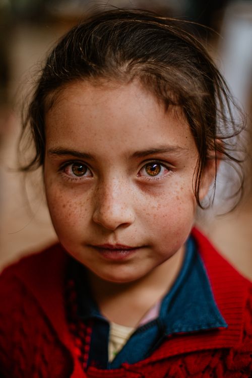 Free Close-up portrait of a young girl with freckles in Cajamarca, Peru. Stock Photo