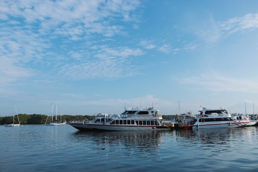Peaceful scene of luxury motor yachts docked on a lake under a clear blue sky.