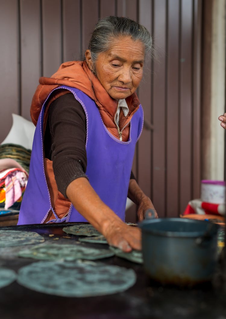 Elderly Woman Working In Kitchen