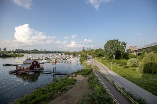 Riverside Road with a Boathouse and a Marina in the Background