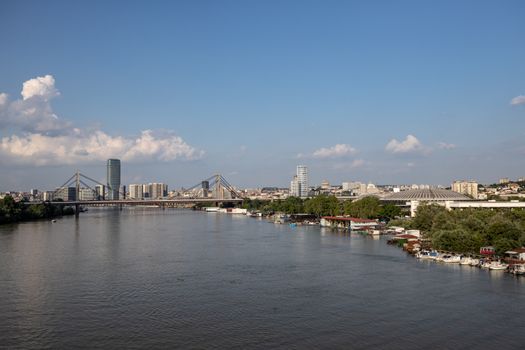 A captivating view of the Sava River with Belgrade skyline, bridges, and clear summer skies.