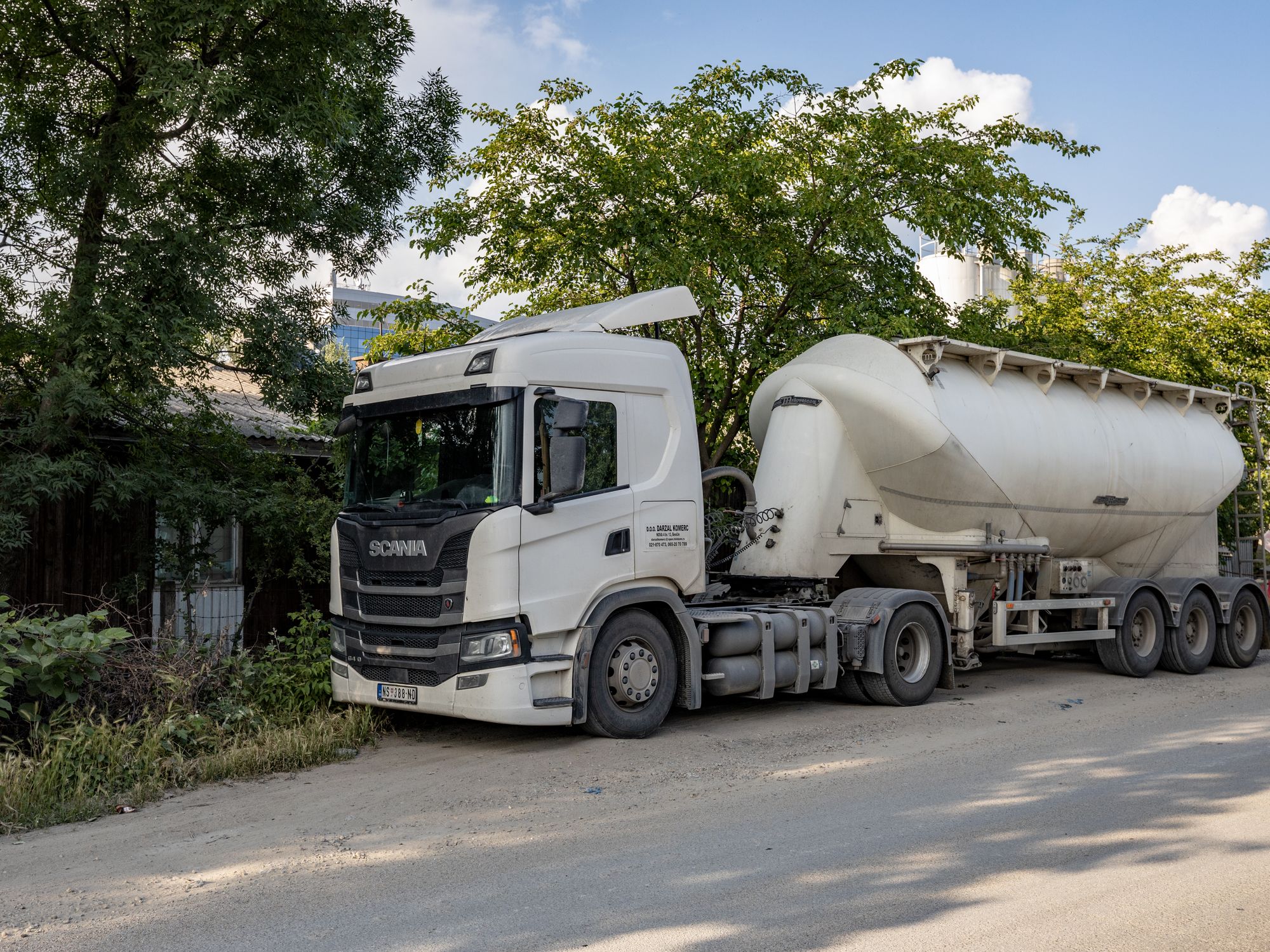 House Removals in Akeley, South East — removals crew carrying furniture out to the removal lorry