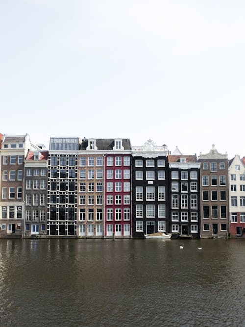 View of Waterfront Buildings near the Canal in Amsterdam, the Netherlands 