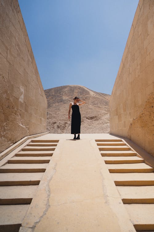 Woman Walking in Ancient Temple