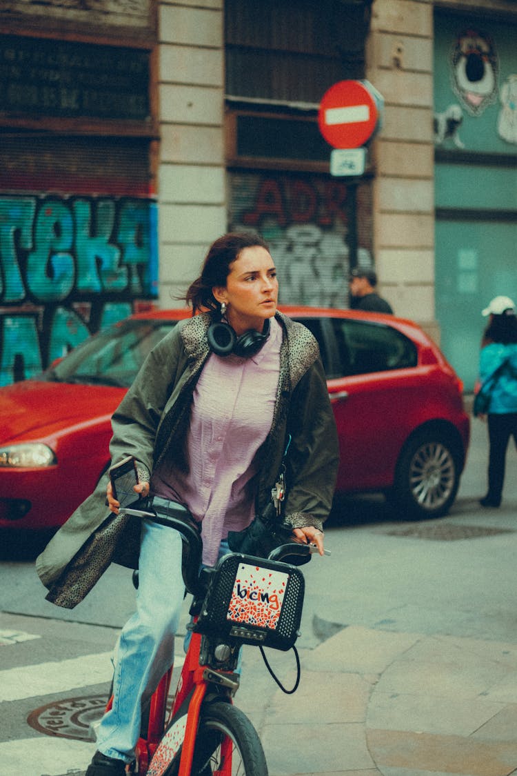 Woman Riding A Bicycle In A Street