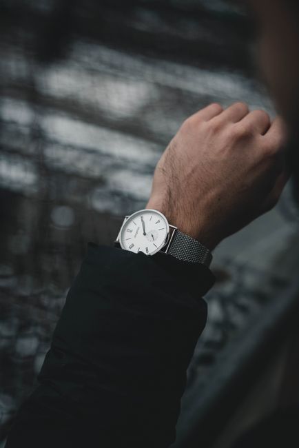 A stylish wristwatch on a man's wrist, showcasing timeless elegance and fashion.