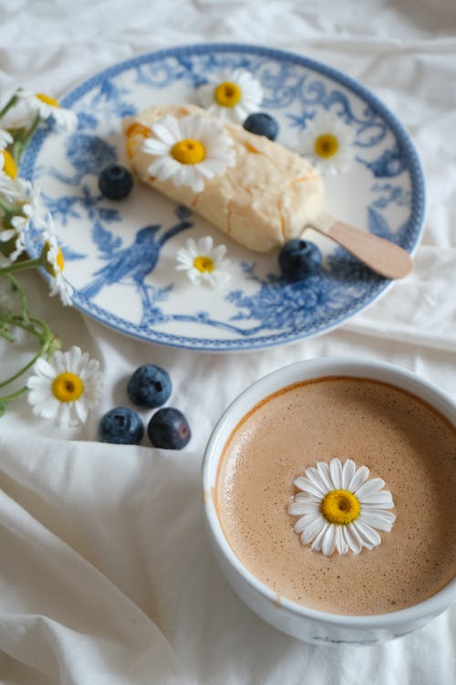 A Cup of Coffee and Ice Cream Decorated with Flowers 