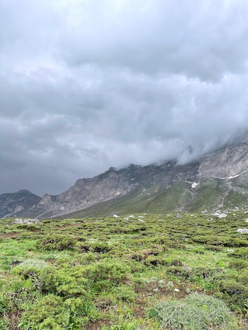 Scenic Mountains Covered by Clouds 