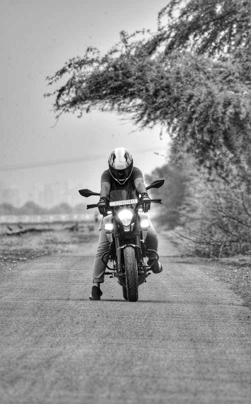 Biker Riding a Motorcycle on a Country Road