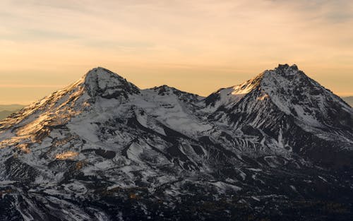 Landscape of Rocky Snowcapped Mountains at Sunset 