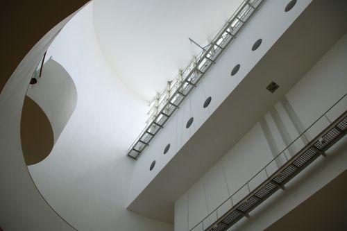 Free Low angle view of a contemporary architectural interior showcasing sleek lines and natural light. Stock Photo