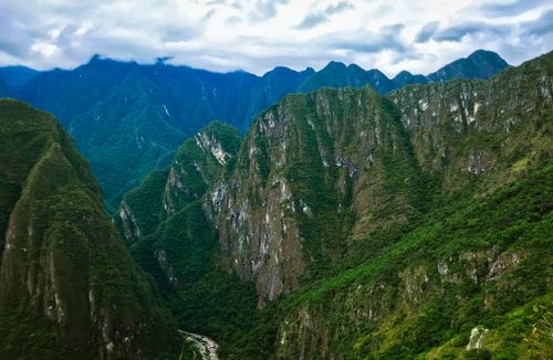 Free Breathtaking view of lush green mountains in the Andes, Cusco, Peru under a cloudy sky. Stock Photo