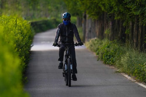 A Cyclist on an Asphalt Road 