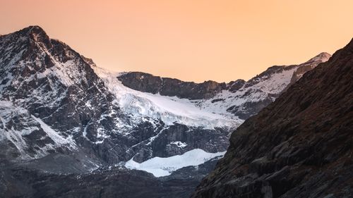 Free Stunning view of the snow-capped Alpine mountains at sunrise, showcasing nature's beauty. Stock Photo