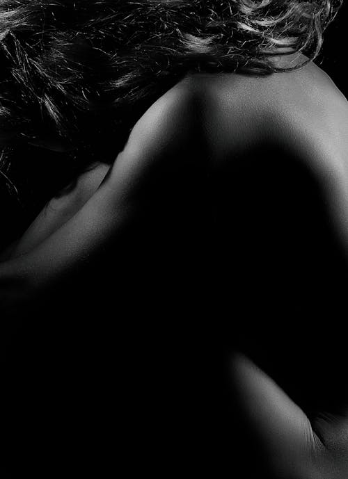 Dark Studio Shot of a Naked Woman 