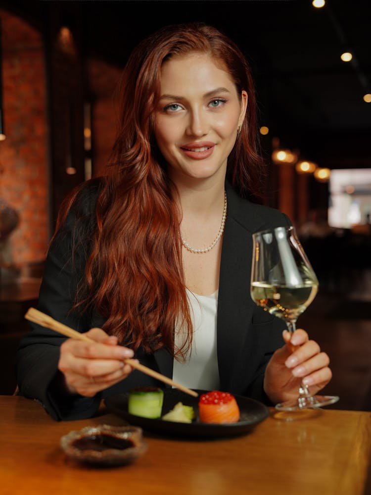 Woman Eating With Chopsticks