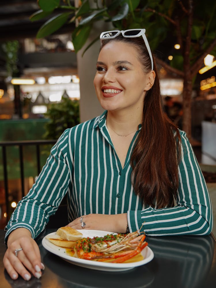 Woman Eating Lobster At Bar