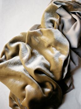 Elegant close-up of soft and luxurious velvet fabric in natural light, capturing its texture and shine.