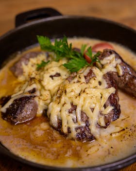 Mouthwatering beef stew topped with melted cheese, perfect for a hearty meal.