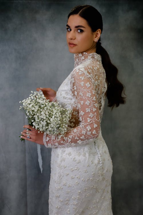 Bride in Wedding Dress Posing with Bouquet
