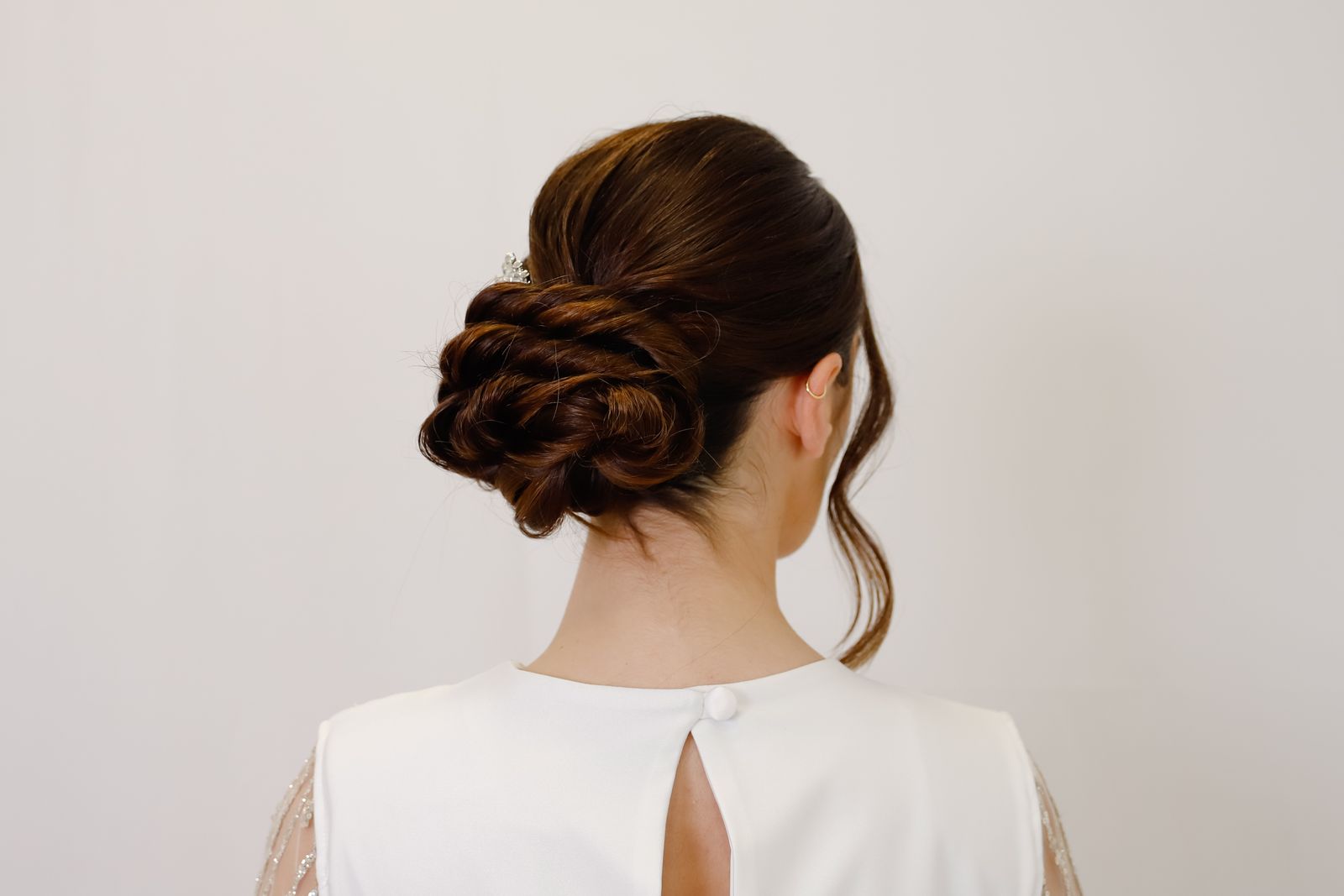 Elegant bridal low bun hairstyle