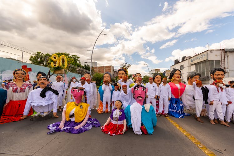 Group Photograph Of People Wearing Festival Costumes, And Puppets