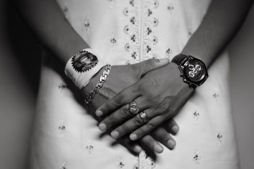 Womans Hands with Ring, Wristwatch, Bracelet and Cloth with Ganesha Face