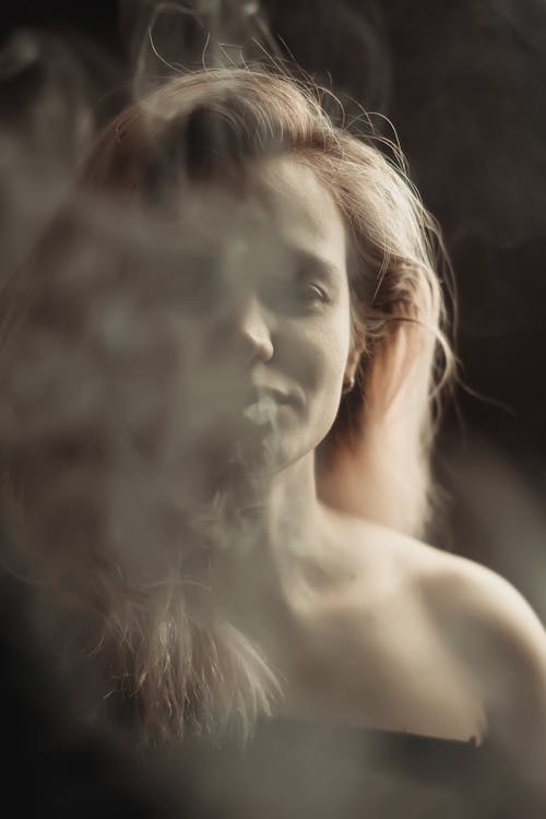 Photo of a Woman Covered with Smoke