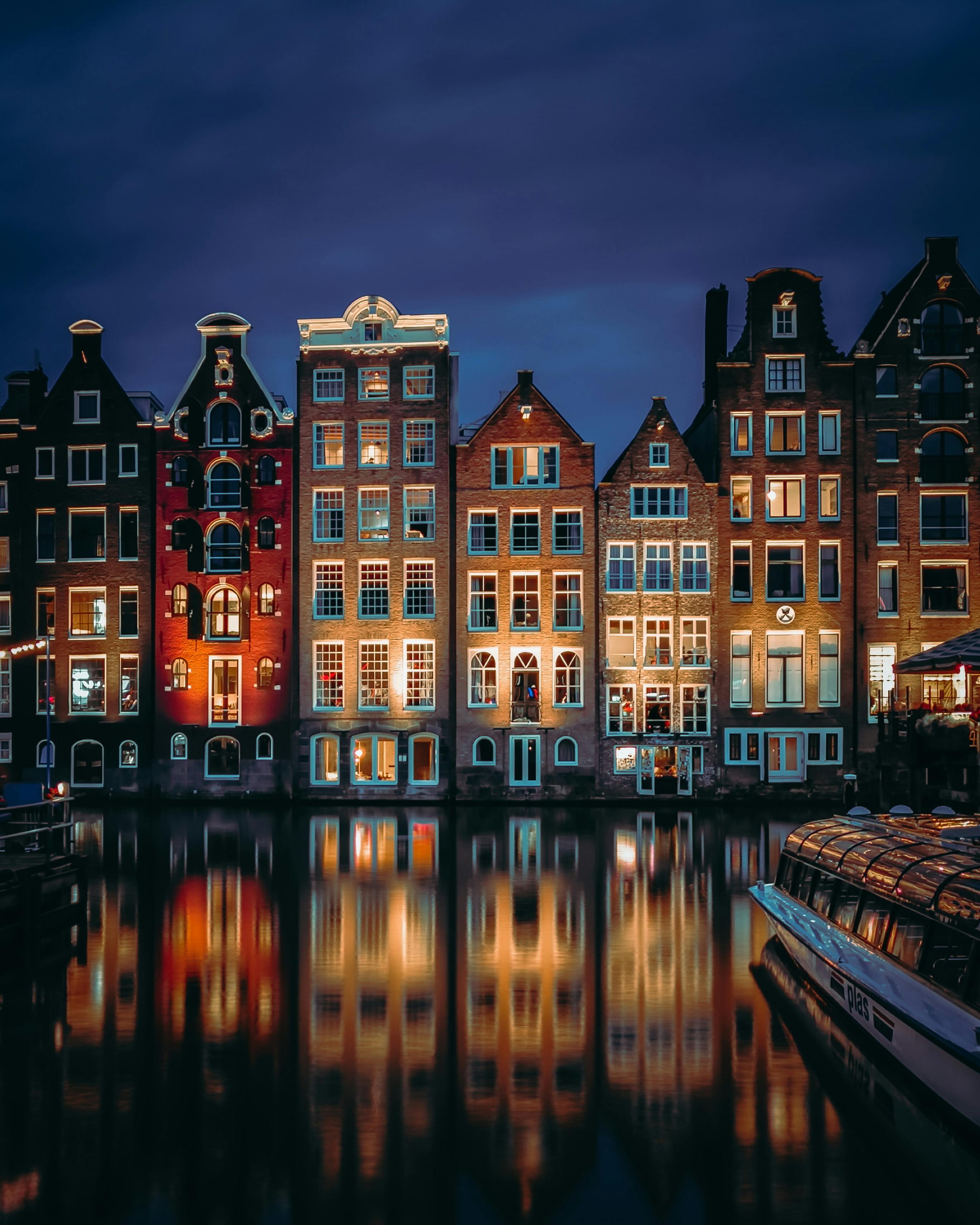 Illuminated Tenements In Amsterdam · Free Stock Photo