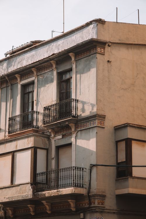Free Charming Spanish residential building facade with intricate balconies in Valencia, Spain. Stock Photo