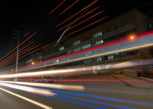Captivating long exposure of light trails against a city building in Tarma, Peru.