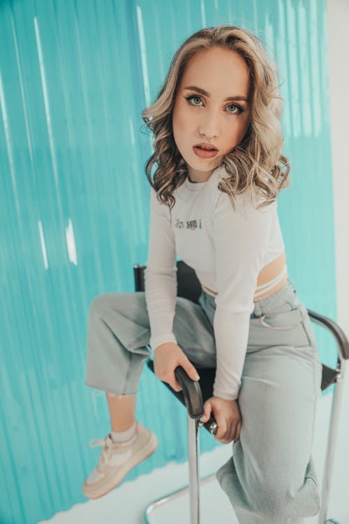 Blonde Woman Sitting on Chair