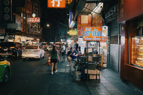 A Market on a Busy Street at Night