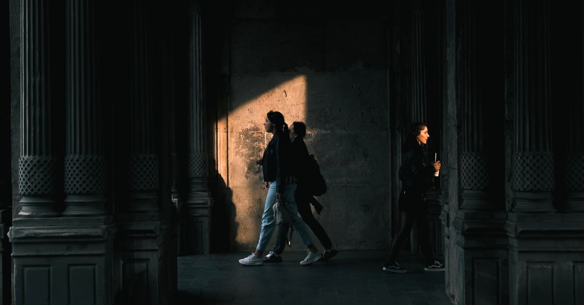 Near Shadow Women Walking near Wall in Shadow · Free Stock Photo