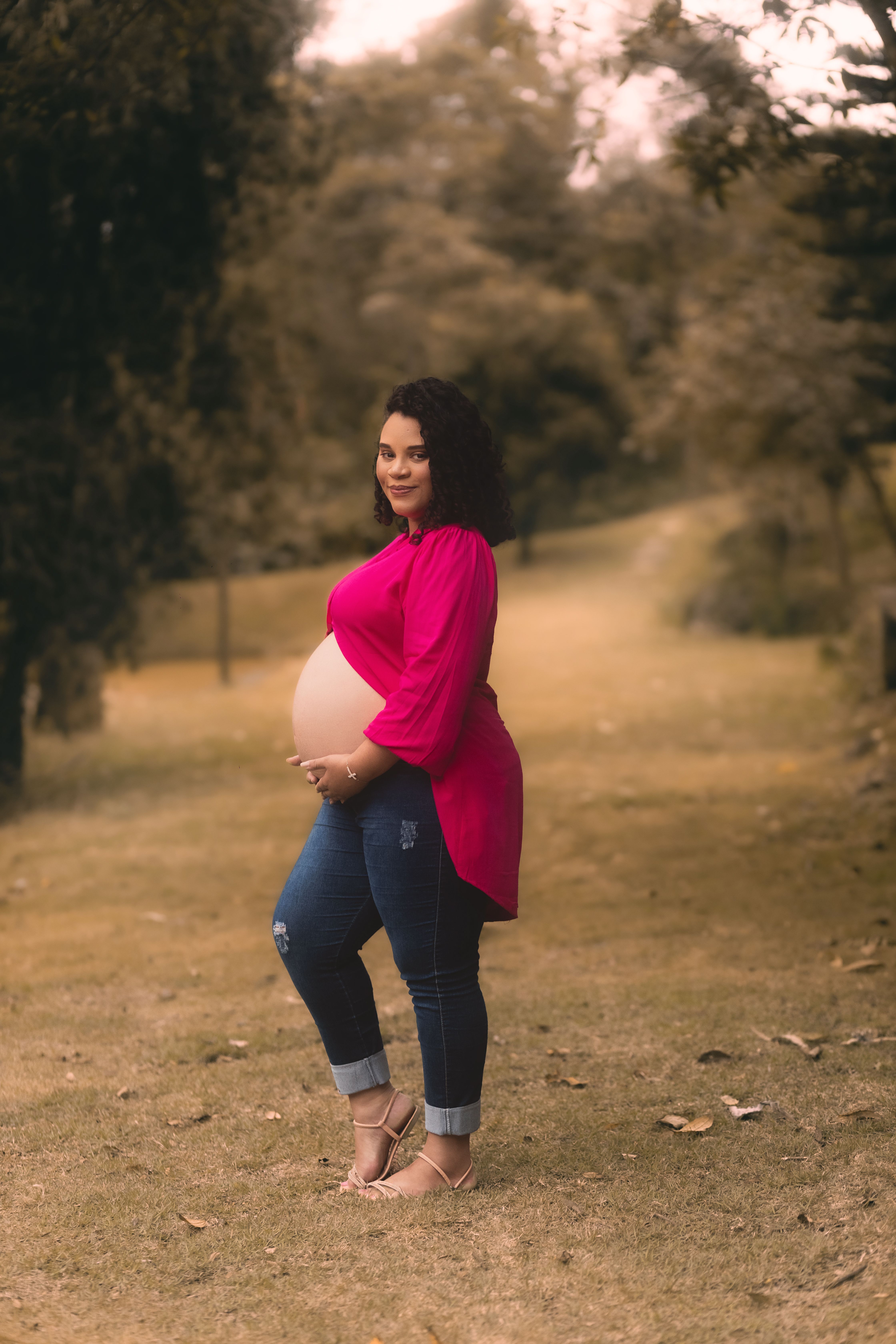 Pregnant Woman Posing among Trees · Free Stock Photo