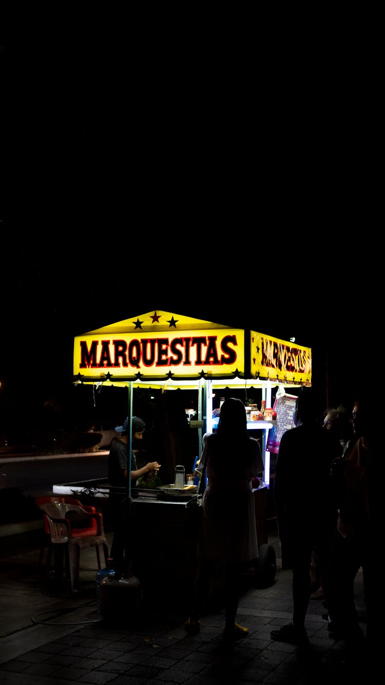 Food Stand In Town At Night