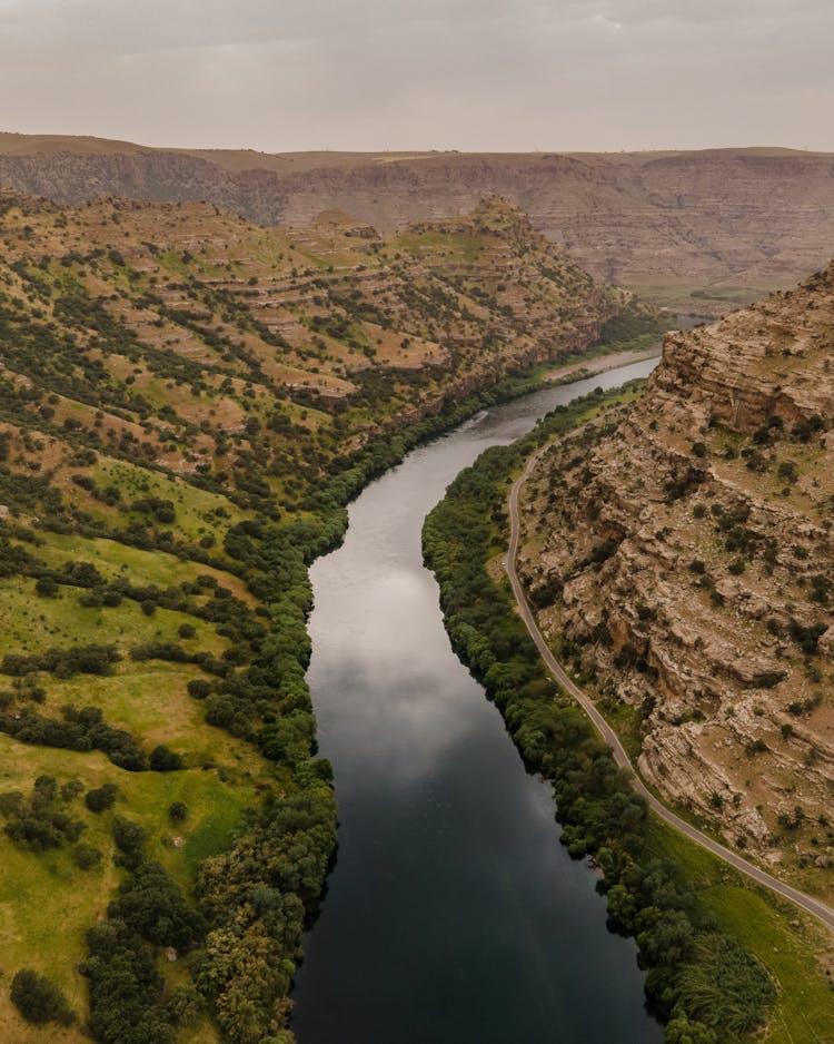 Aerial Photography Of A River Running Through A Valley 