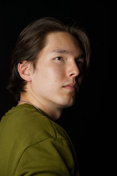 Portrait of a Young Man in a Green Sweatshirt