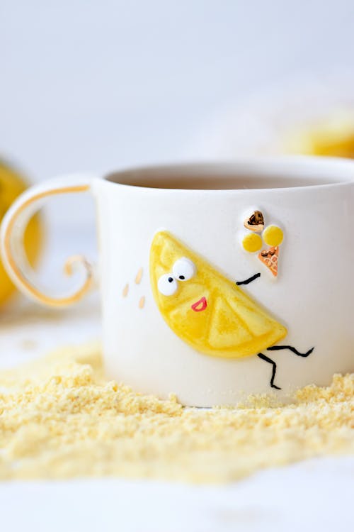 Free Close-up of a Ceramic Cup with a Funny Picture  Stock Photo