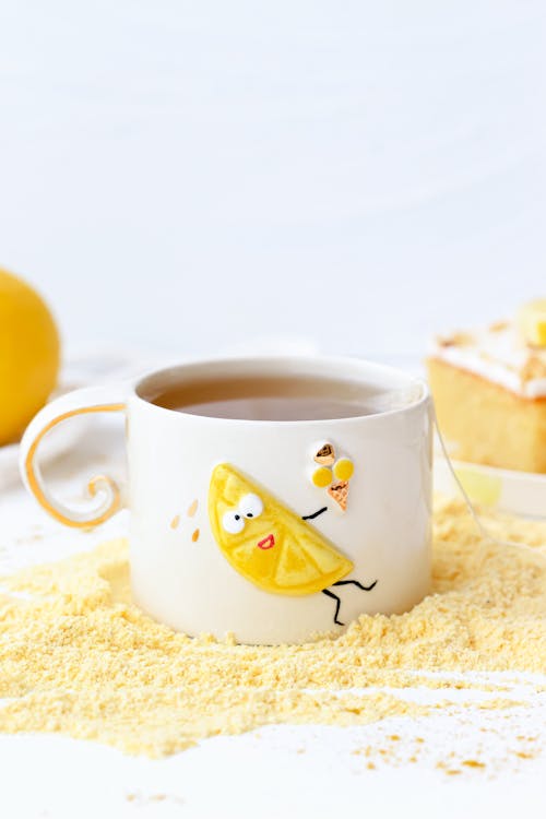 Free A Ceramic Cup with a Funny Illustration  Stock Photo