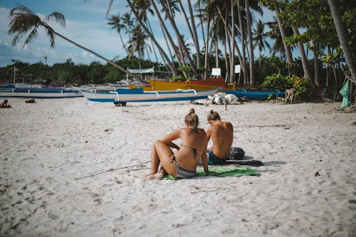 Free People Sitting on Shore Stock Photo