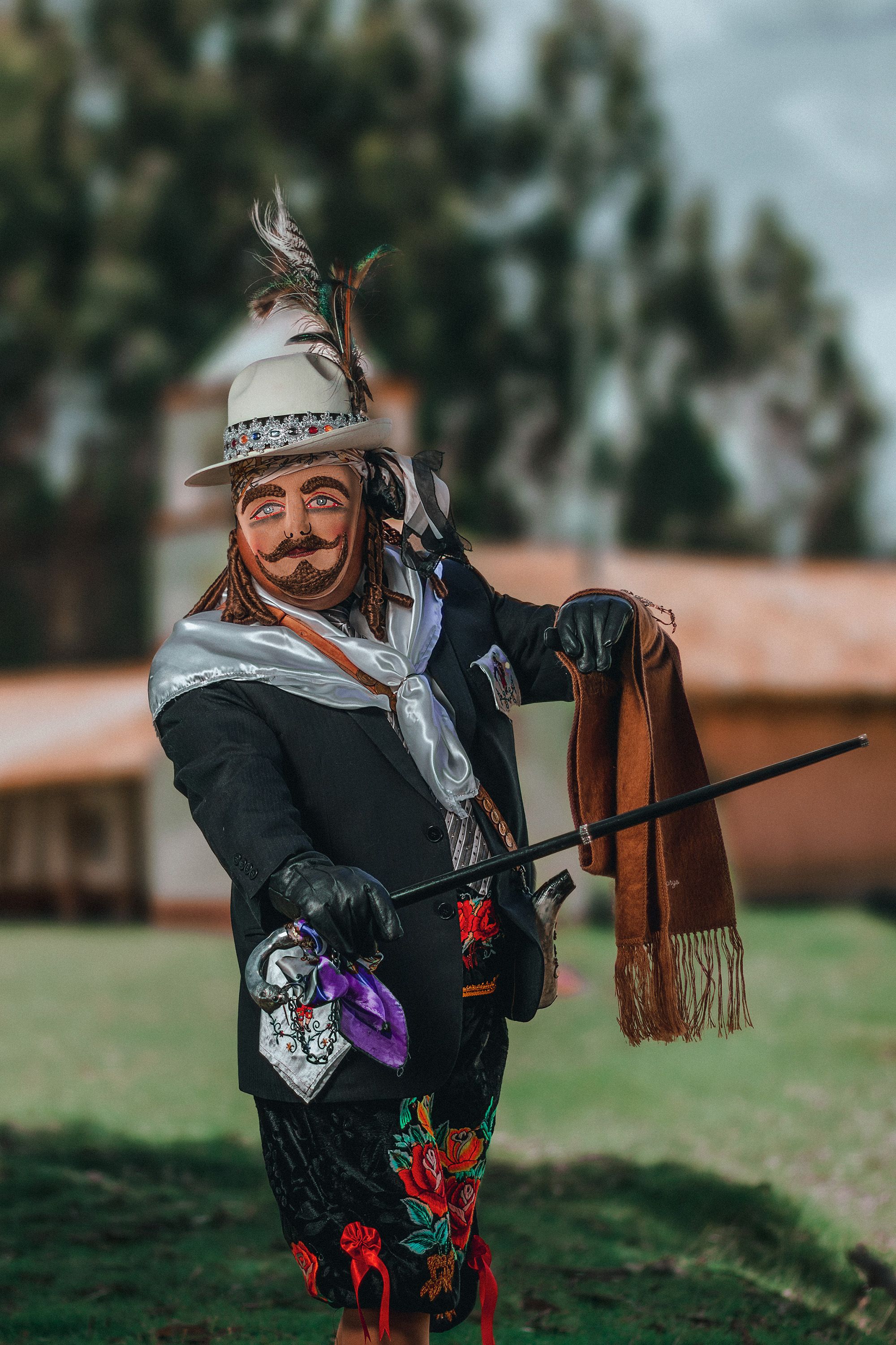 A person in elaborate traditional clothing participates in a vibrant festival in Jauja, Peru.