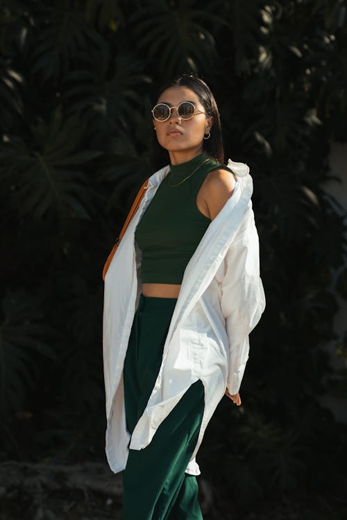 Young Woman in a Fashionable Outfit Posing Outdoors 