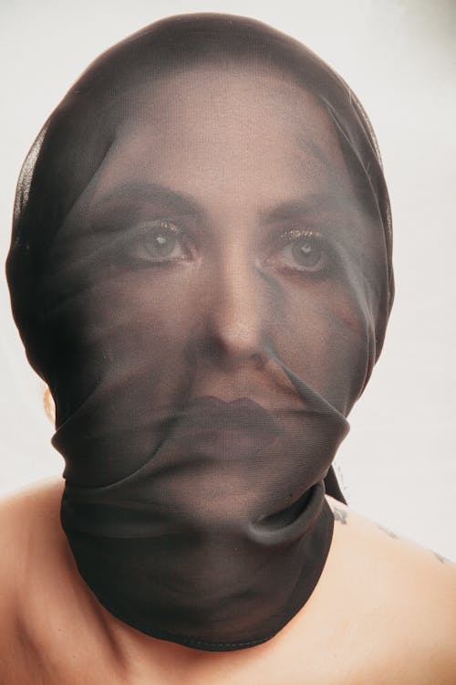 Woman Covering Black Mesh Mask