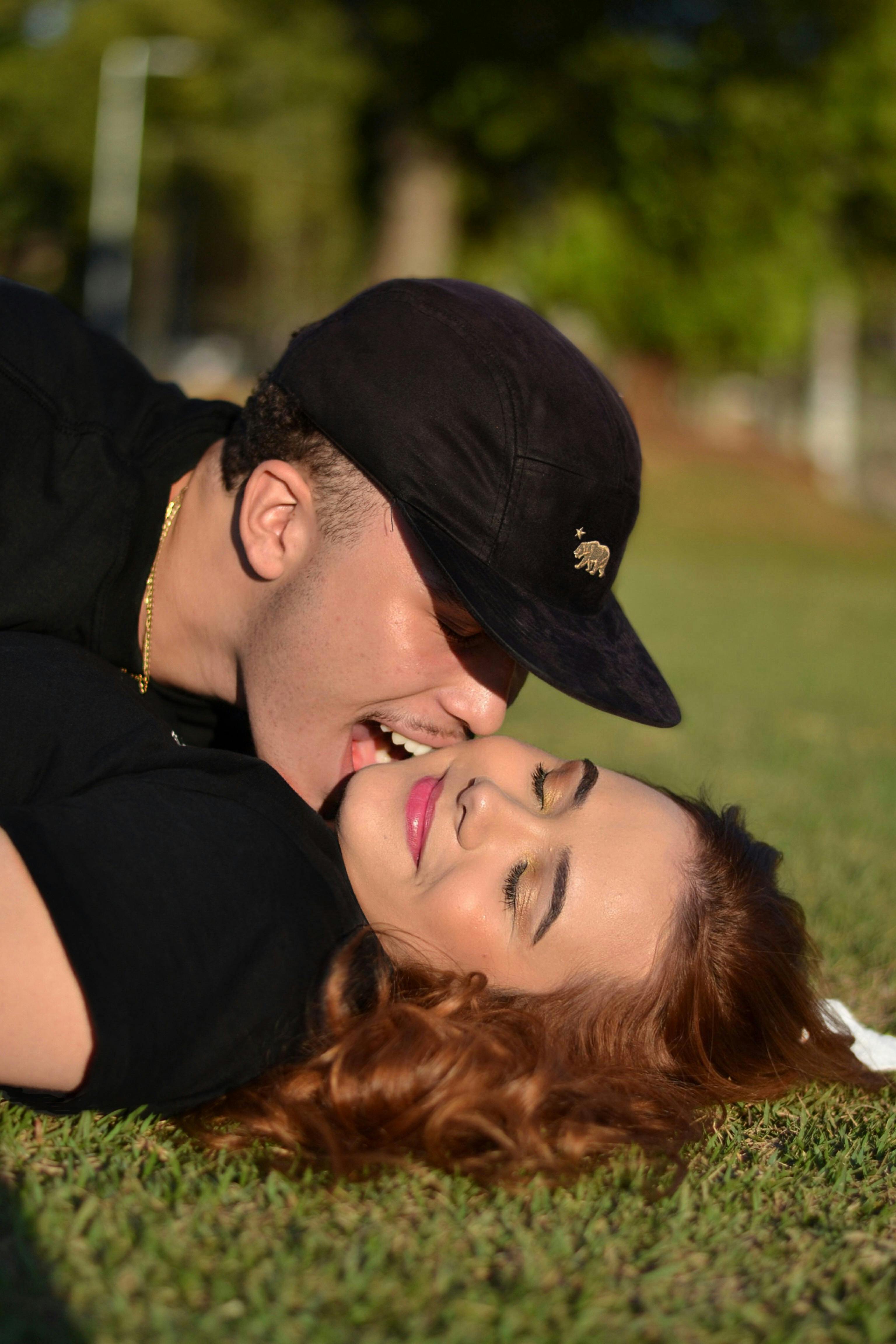 Man Lying On Woman In Kissing Her Neck Free Stock Photo   Free Photo Of Man Lying On Woman In Kissing Her Neck 