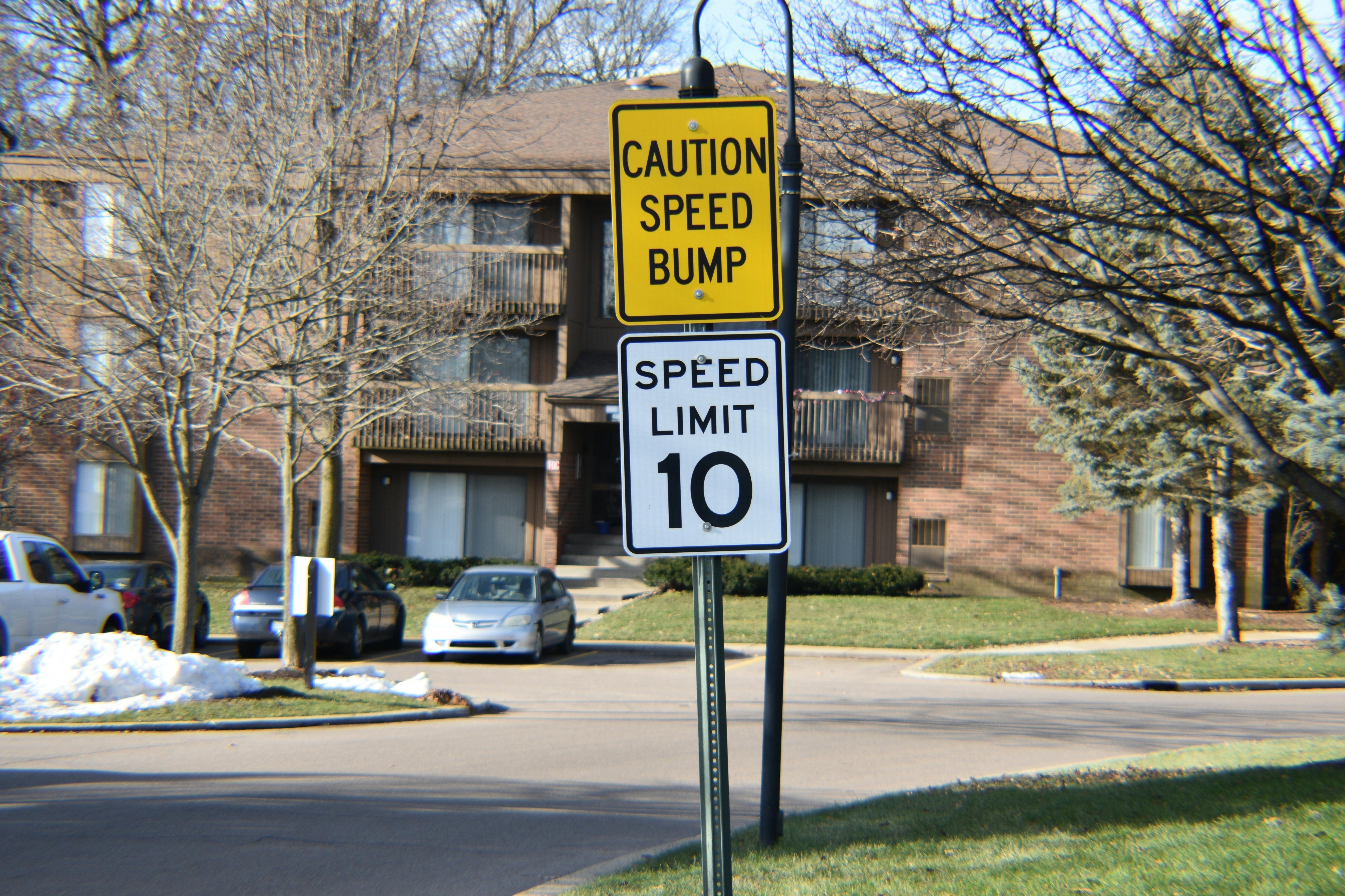 Free stock photo of speed bump, speed limit, street sign