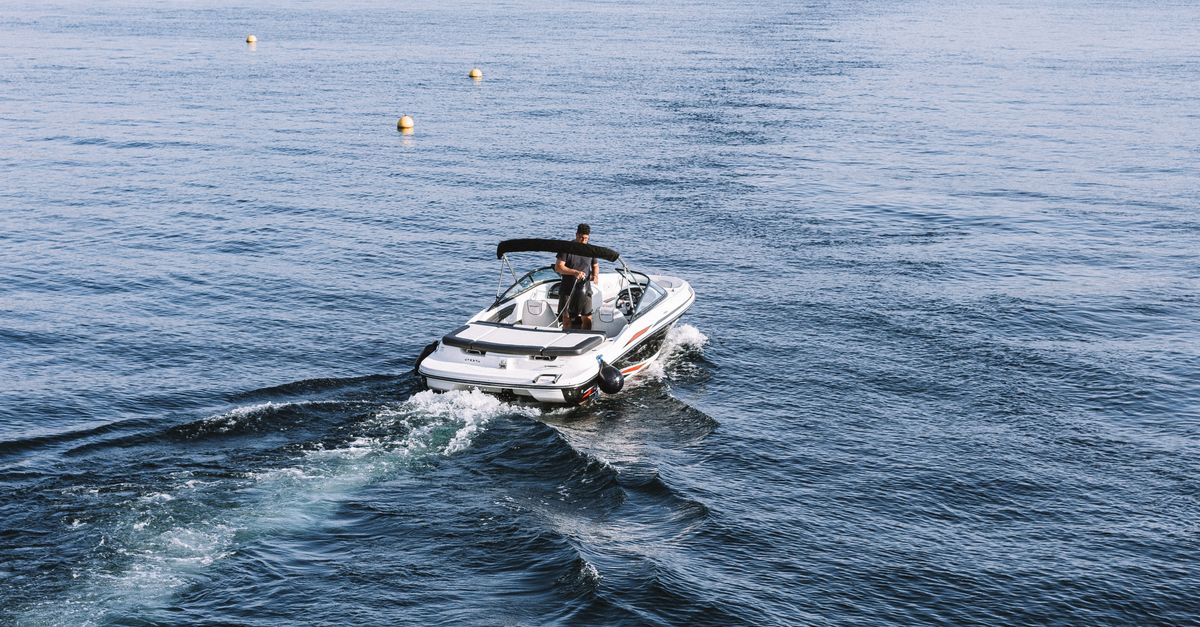 A Man Riding on a Motorboat · Free Stock Photo