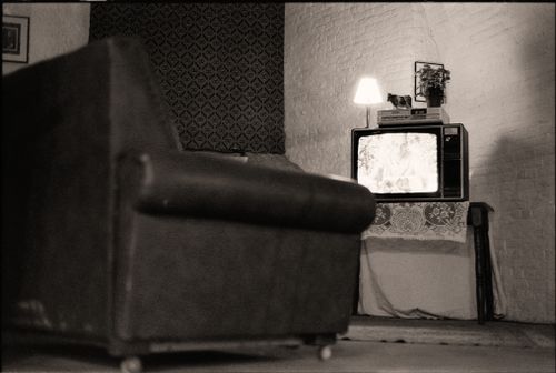 Free Cozy black and white retro living room featuring vintage television and furniture. Stock Photo