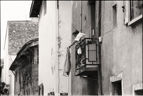 A Woman Hanging Laundry in Black and White