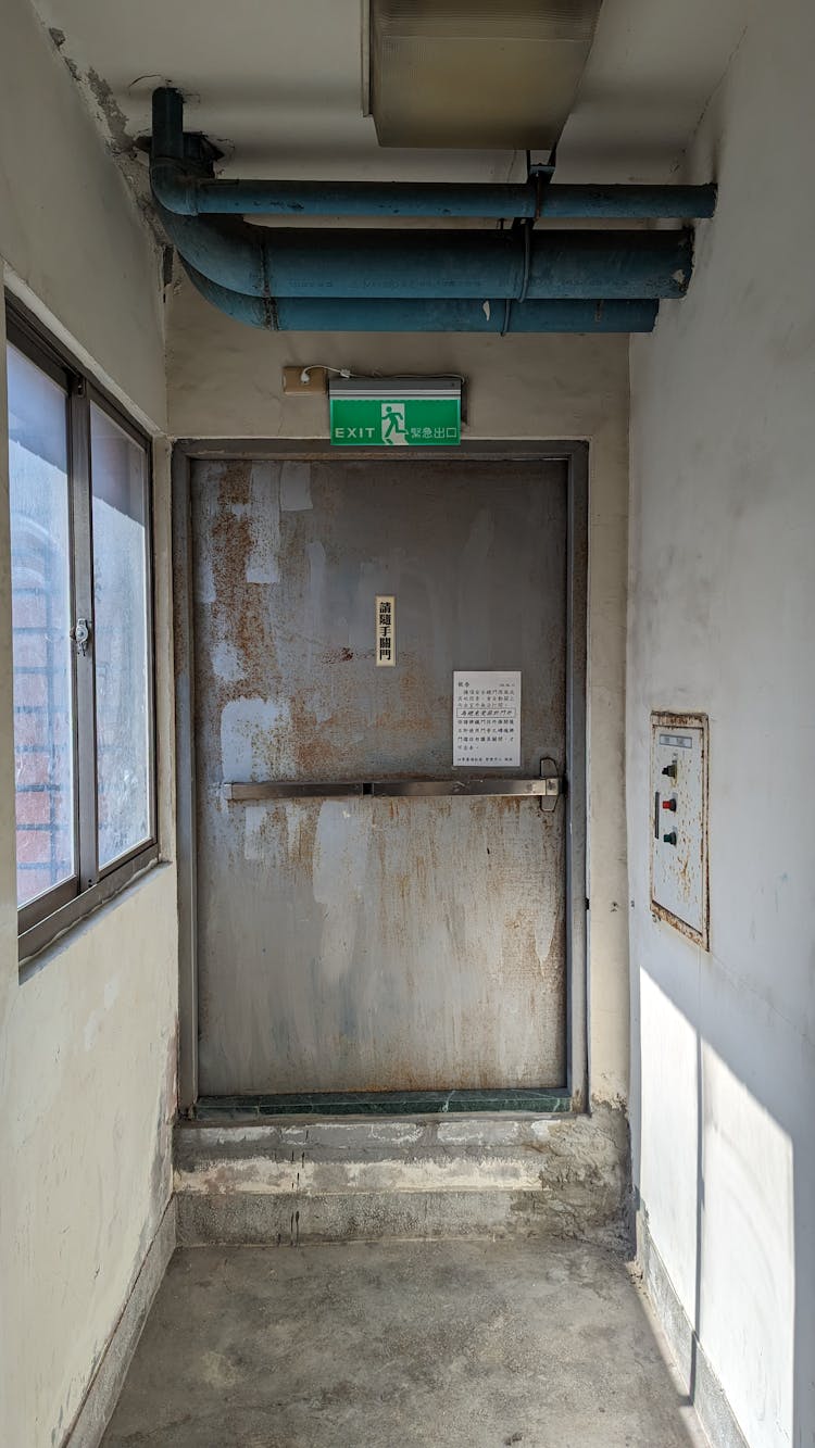 Door In Abandoned Corridor